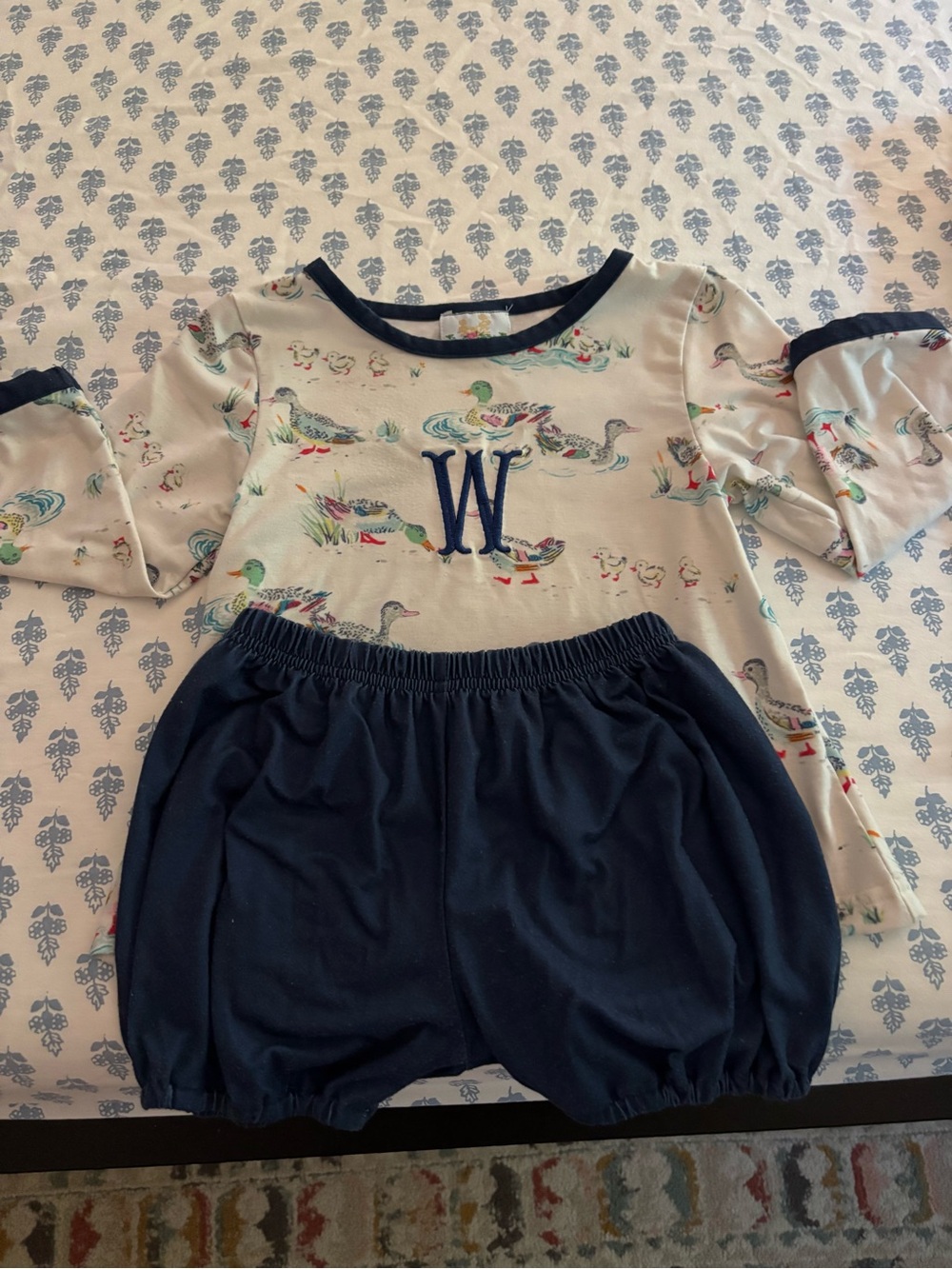 Busy Bees Smocked Baby Dress - White with Blue Print